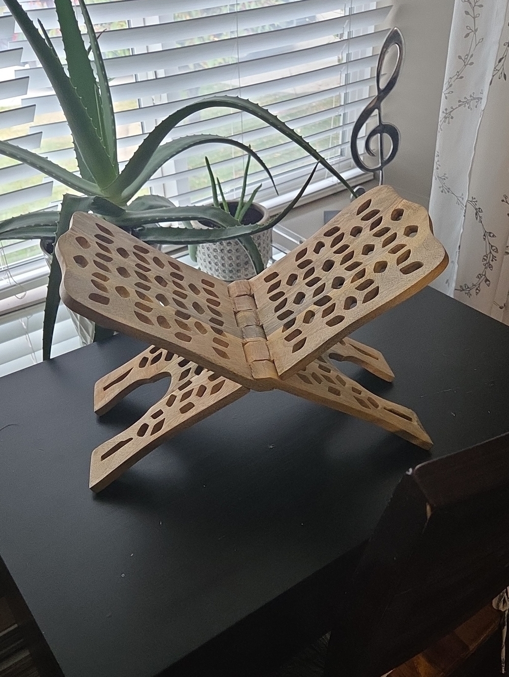 Carved wooden book holder.